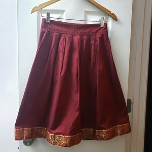 Beautiful red skirt with floral gold trim